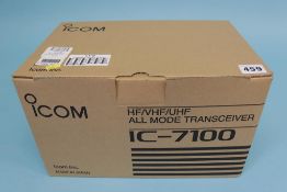 A boxed ICOM IC - 7100 transceiver