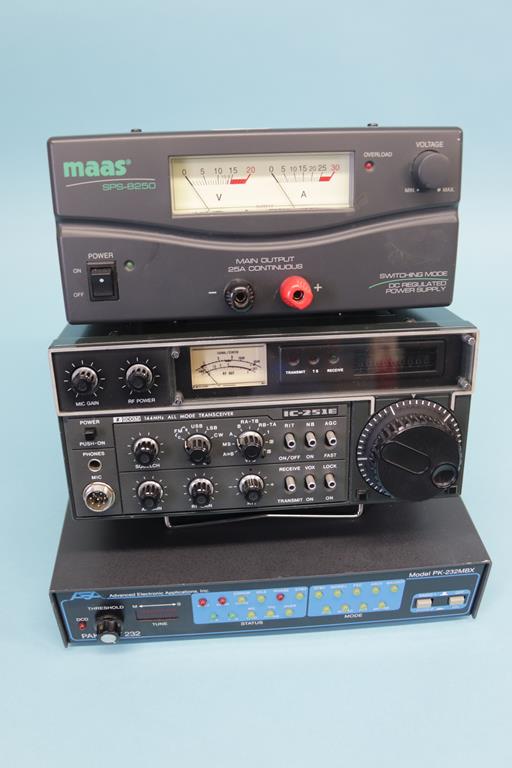 An unused ICOM IC-251E multi mode base station, a Maas SPS - 8250 and Pakratt 232, model PK - 232