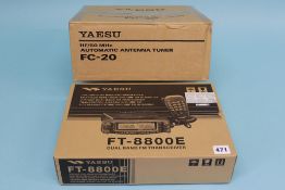 A boxed Yaesu FC-20 Antenna tuner and a boxed FT 8800 dual band transceiver