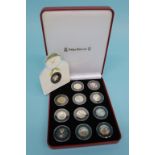 A boxed Presentation Pobjoy Mint Limited 'Snowman' Isle of Man collection coloured 50 pence set of