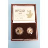 A boxed Britannia two coin set proof, weight 1/4 8.513 grams, weight 1/10 3.412 grams