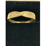9ct Gold crossover ring set with diamonds Weight 1