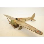 An early wind-up tin plate aircraft made in England - wing span 42 cm (in working order)