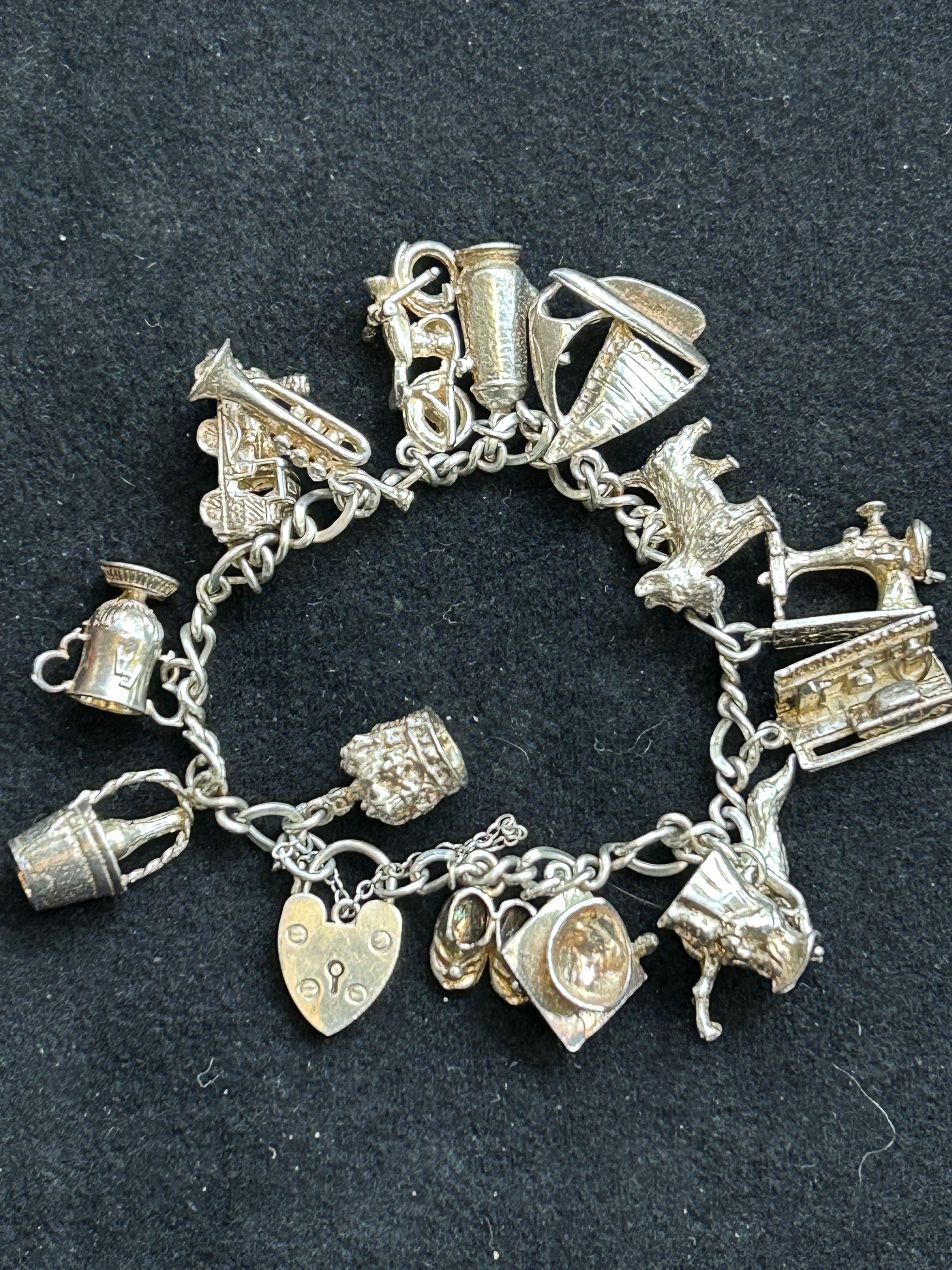 Silver charm bracelet - 15 charms