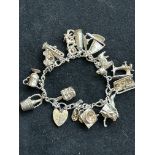 Silver charm bracelet - 15 charms