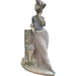Lladro figure of a leaning lady Height 39 cm