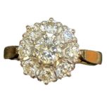 18ct Gold set with 8 diamonds surrounding central