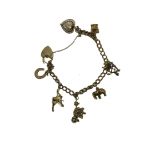 9ct Gold charm bracelet with 7 charms & heart shap