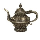 White metal Chinese finely worked teapot with drag