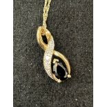 9ct Gold chain & pendant, pendant set with blue st