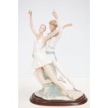 large Nao figure of a dancing couple on wooden pli
