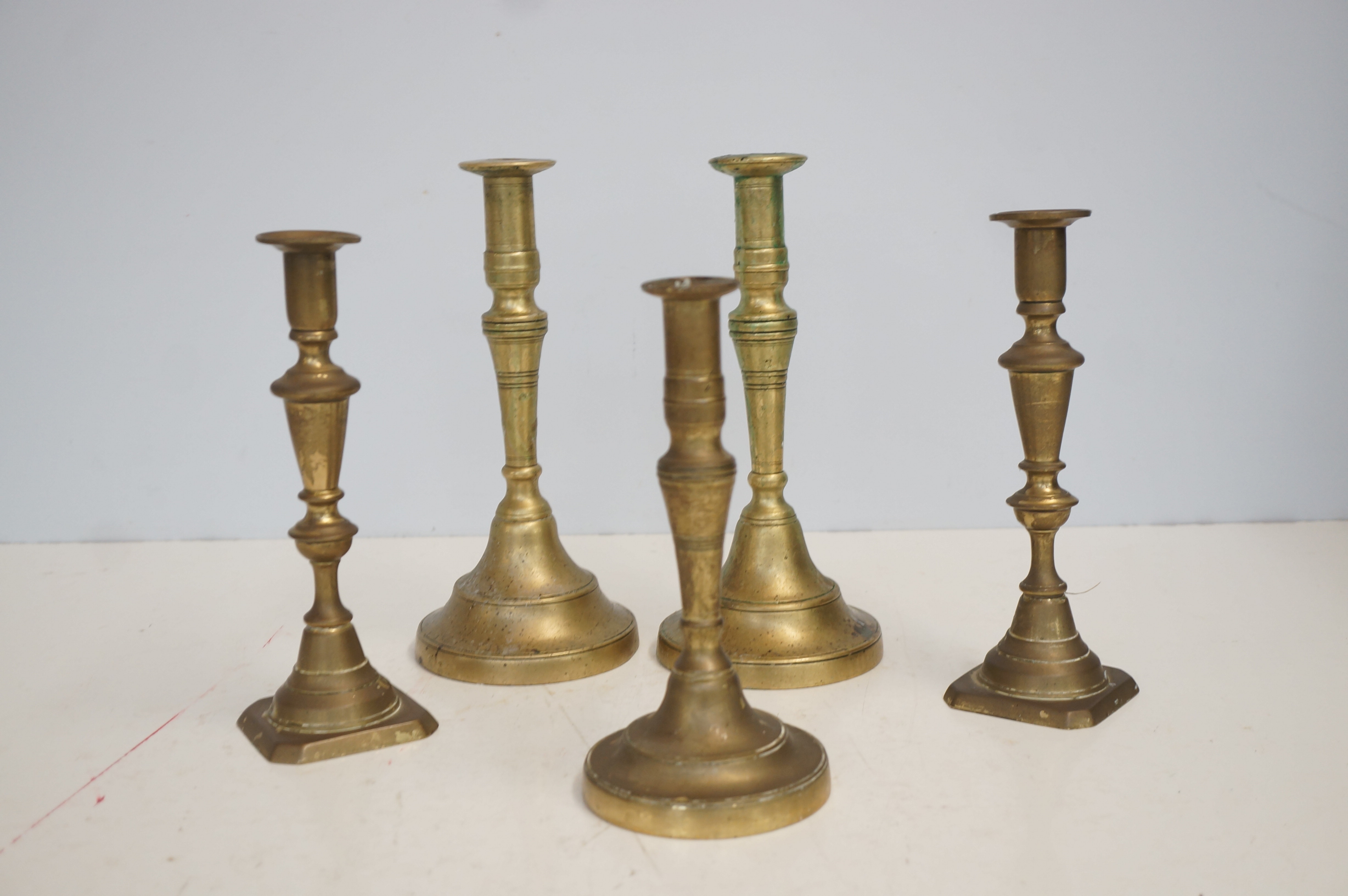 5 Heavy brass candle sticks