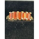 9ct Gold ring set with 5 red stones Size Q 2.7g