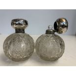 2x Silver topped large perfume bottles Height 14 c