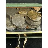 Vintage money box containing world coins with key