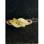 9ct Gold ring set with 3 peridot stones & diamonds