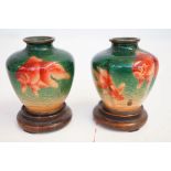 Pair of Oriental enamelled vases on stands Height