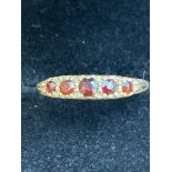 9ct Gold ring set with 5 red stones Size S 1.5g