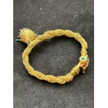 Asian yellow metal bracelet