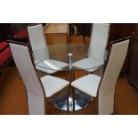 Circular dining table with chrome under carriage &