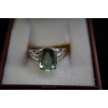 Silver ring with green stone