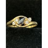 9ct Gold ring set with sapphire & 4 cz stones Size