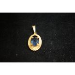 18ct Gold pendant set with blue stone