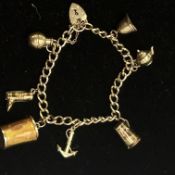 9ct Gold charm bracelet - 7 charms Weight 16.7g