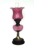 Early 20th century oil lamp with cranberry glass r