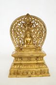 Gilt bronze repousse throne & aureole with buddha