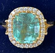 Colombian Emerald and diamond ring set in 18ct gol