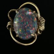 Black opal set in a 9ct gold ring. Stone approx 15