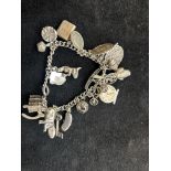 Silver charm bracelet - 25 charms