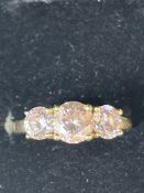 14ct Gold ring set with 3 pink coloured stones Siz