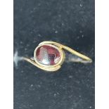 9ct Gold ring set with red stone Size Q 1g