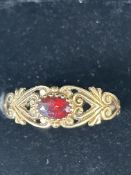 9ct Gold ring set with red garnet stone Size W 2.2