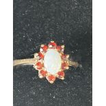 9ct Gold ring set with opal & red garnets Size M 1