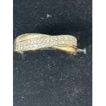 9ct Gold crossover ring set with cz stones Size O
