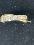 9ct Gold crossover ring set with cz stones Size O