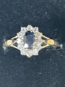 9ct Gold ring set with sapphire & cz stones Size O