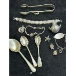 Navada silver sugar tongs together with other silv