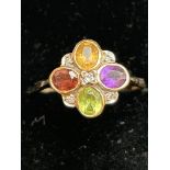 9ct Gold ring set with multi coloured gem stones &