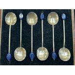 Cased set of art deco silver bean spoon