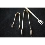 2 Silver sugar tongs & a silver mother of pearl pi