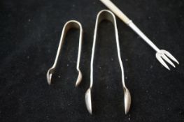 2 Silver sugar tongs & a silver mother of pearl pi