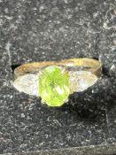 9ct Gold ring set with light green stone & cz ston