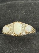 9ct Gold ring set with opals Size N