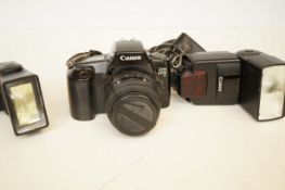Cannon E0S 1000F camera with 2x flashes