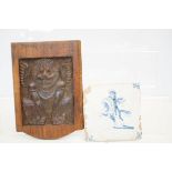 Early possibly Delft tile together with a wooden p