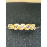 9ct Gold ring set with 3 sapphires & 2 diamonds Si